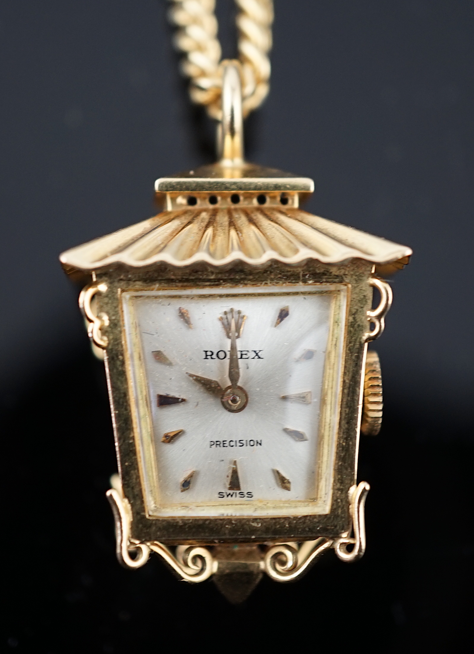 A lady's novelty gold Rolex pendant fob watch, modelled as a lantern, with baton numerals, together with an 18ct gold chain